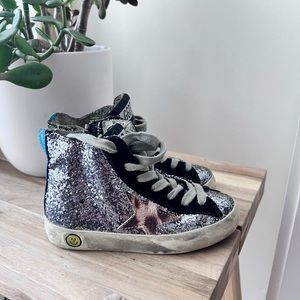 Sparkly high top golden goose sneaker, guaranteed to add lux to any outfit.